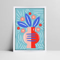 Abstract floral art print with blue leaves and pink vase on a light blue background in a white frame