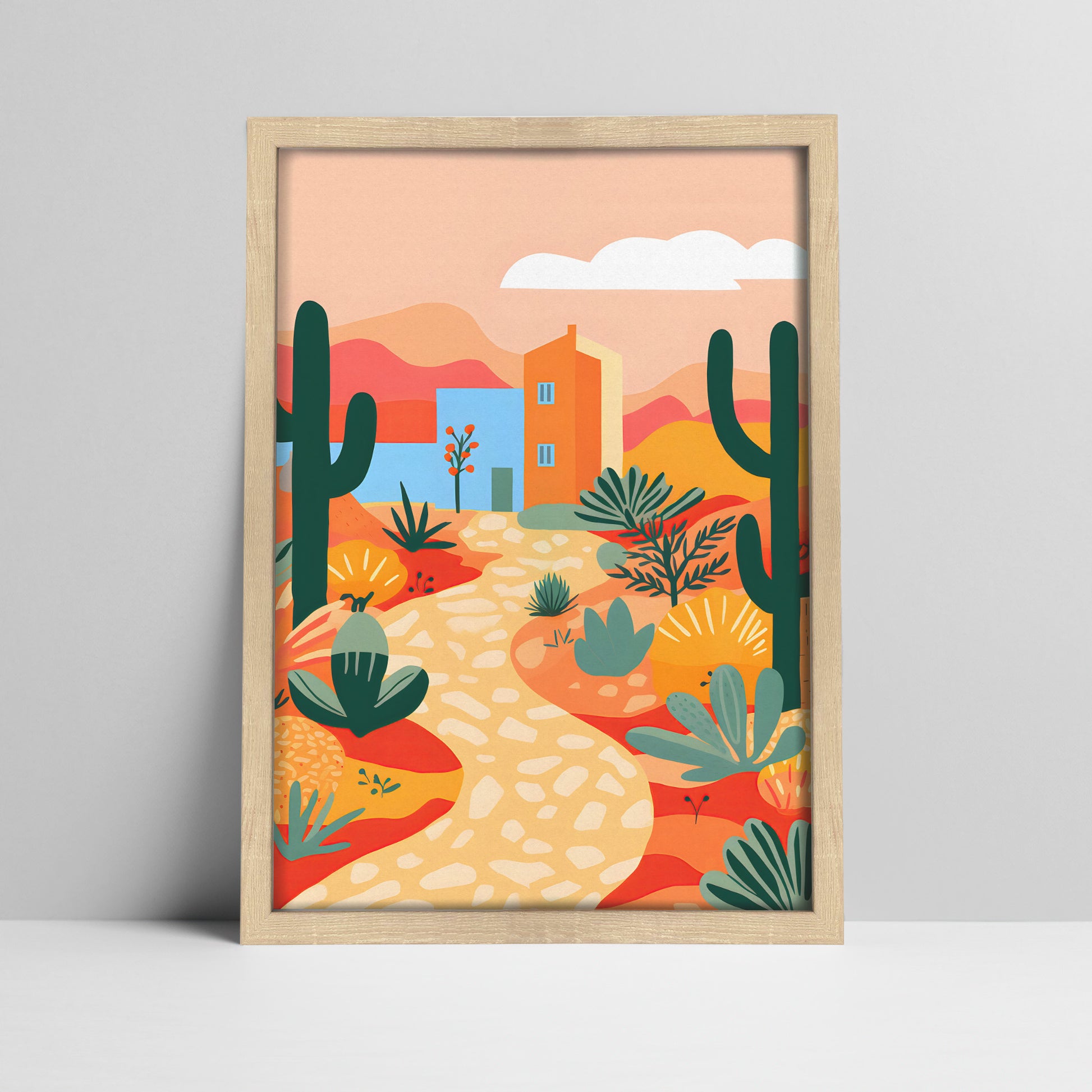 Art print of desert landscape illustration with cacti and house in a light wood frame