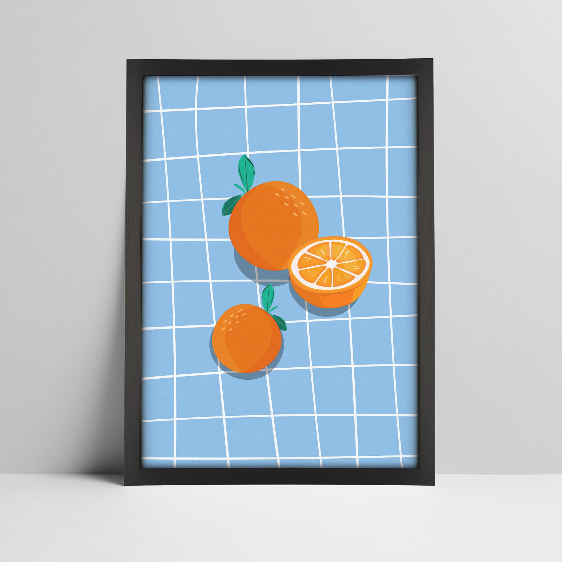 Art print of oranges on blue grid background illustration in a black frame