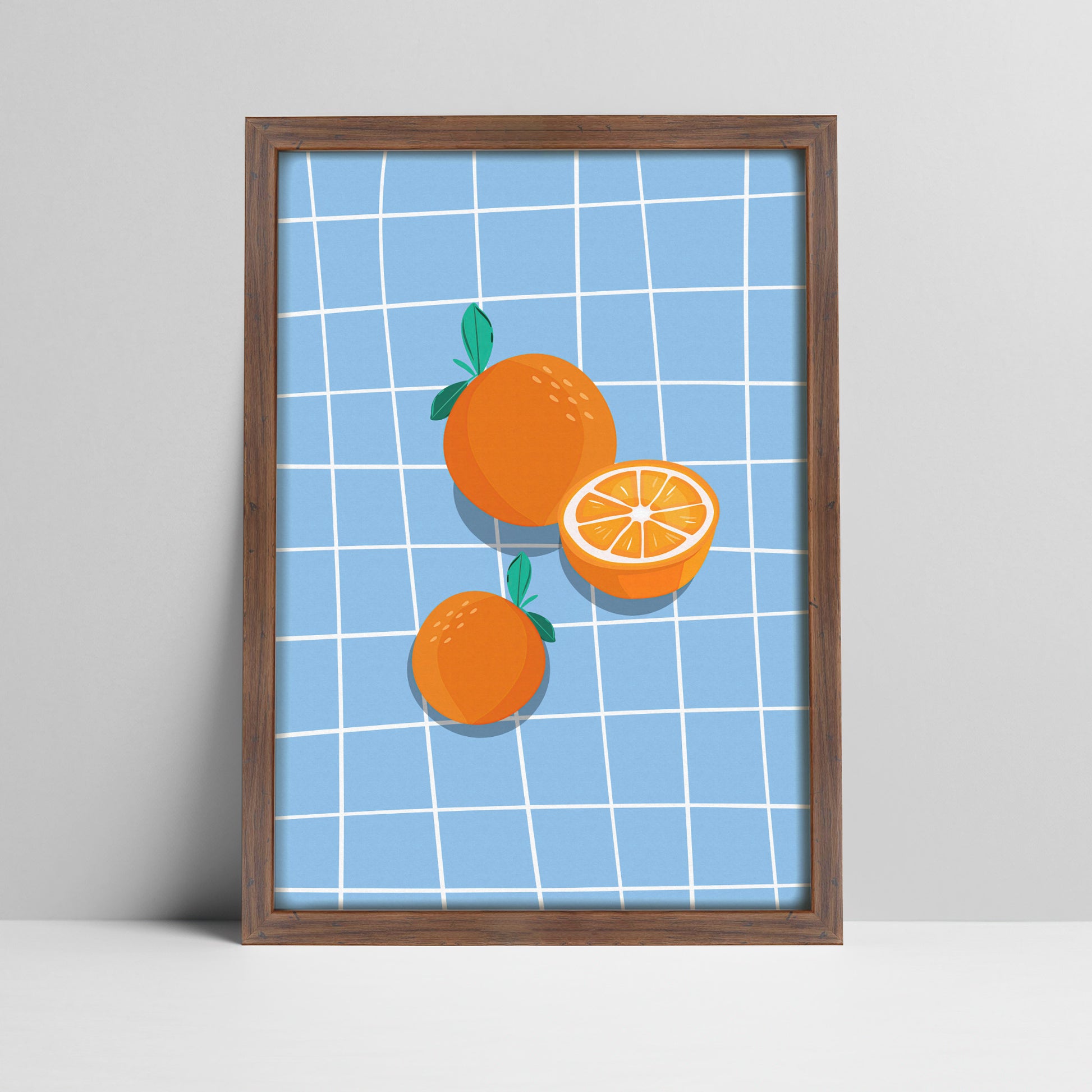 Art print of oranges on blue grid background illustration in a dark wood frame