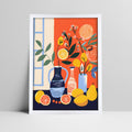 Still life art print with citrus and floral arrangement in a white frame