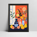 Still life art print with citrus and floral arrangement in a bold black frame