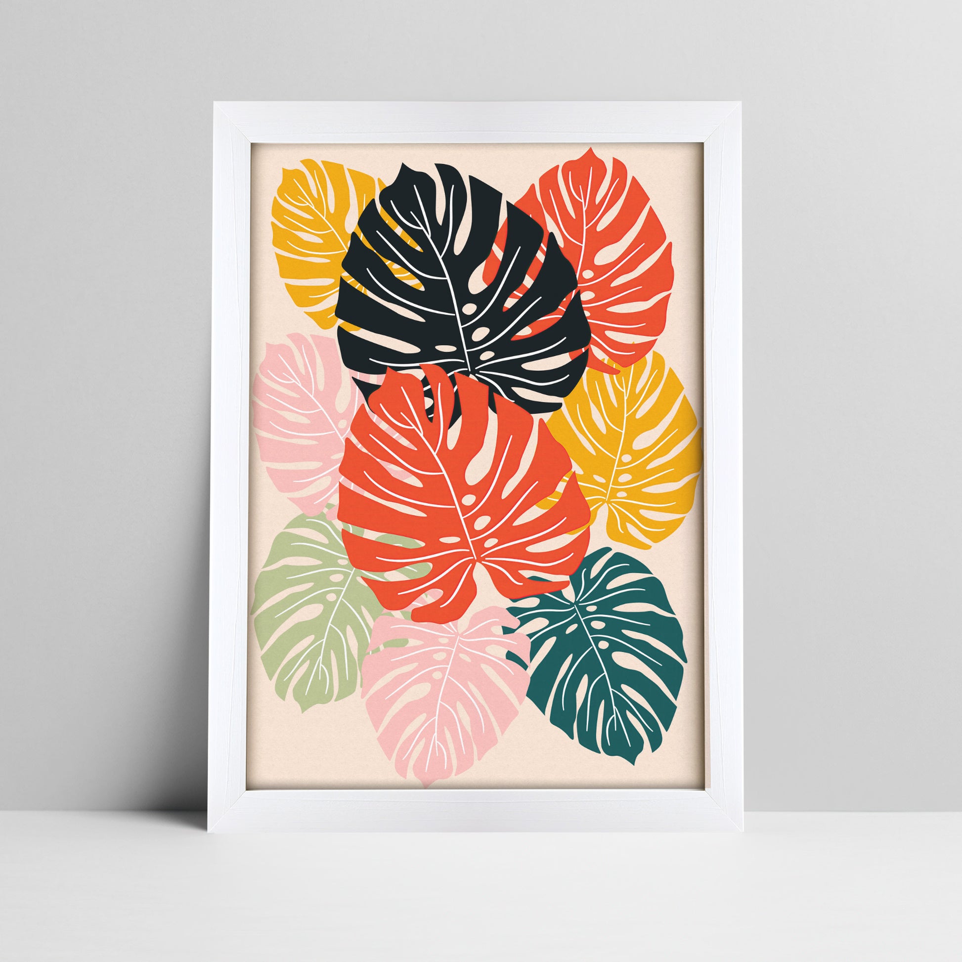 Tropical monstera leaves art print in bold colors in a thick white frame