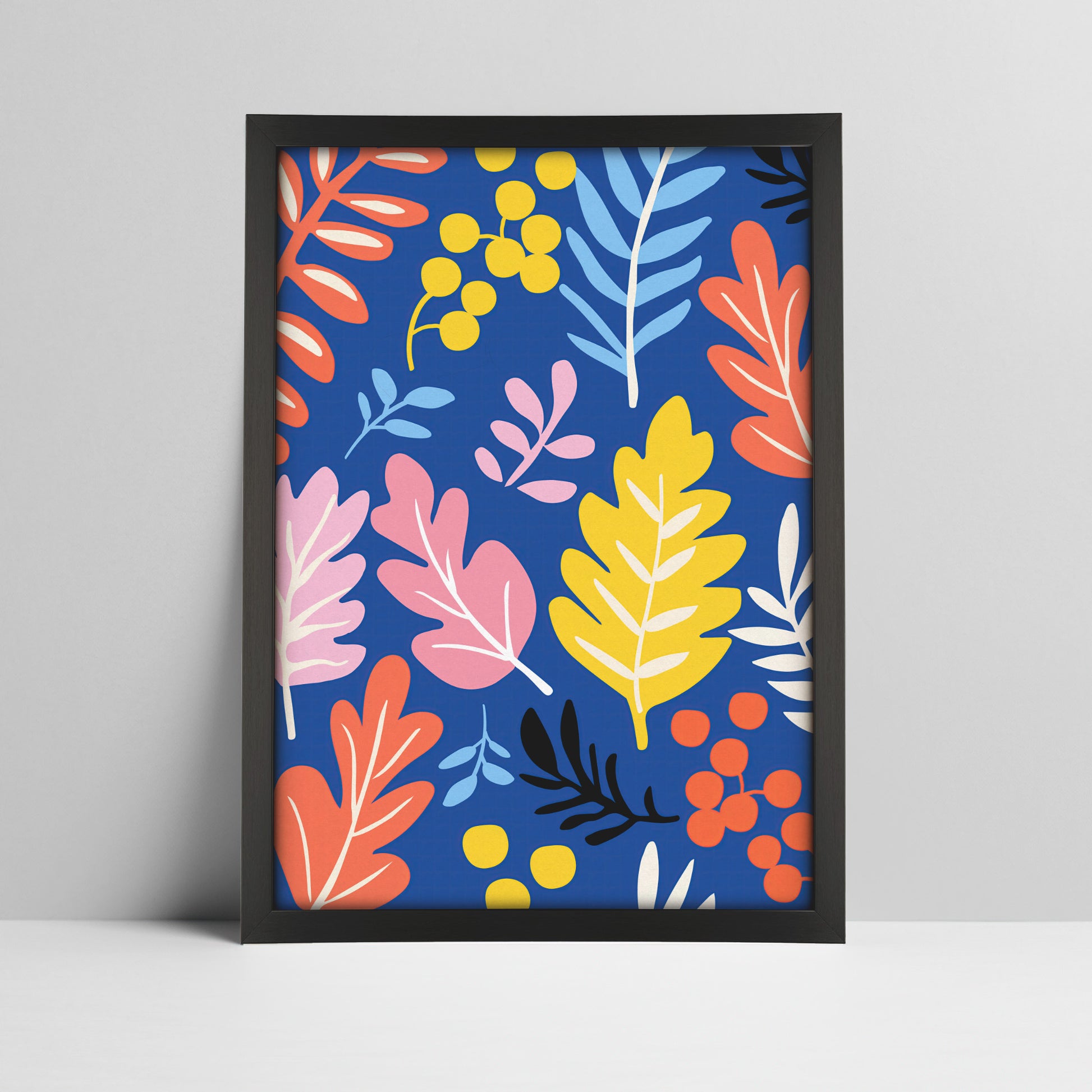 Vibrant botanical print with blue background in a black frame