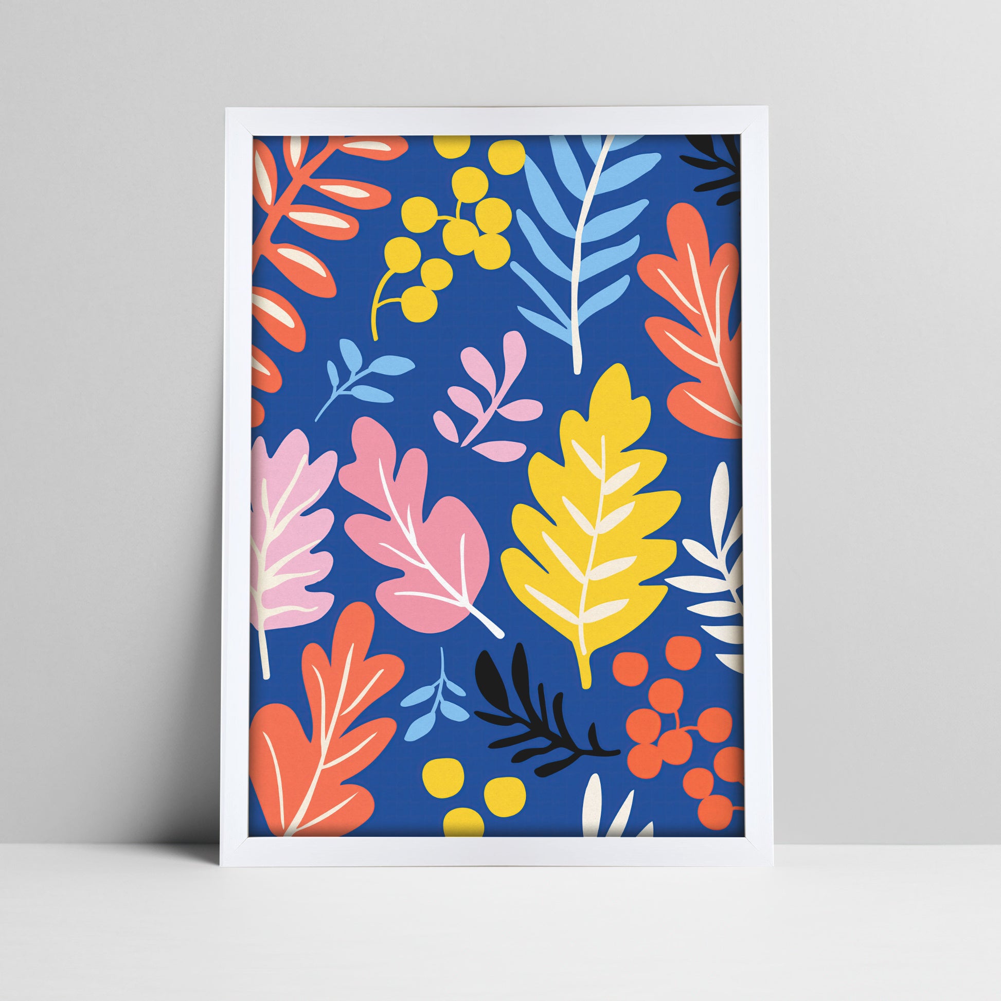 Vibrant botanical print with blue background in a white frame