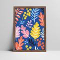Vibrant botanical print with blue background in a dark woodk frame