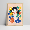 Art print of woman with stylized floral design in a light wood frame